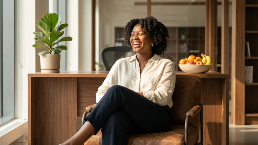 Dietitian laughing naturally in bright modern office