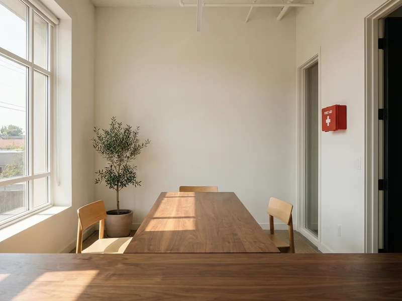 Modern break room with walnut table and first aid kit